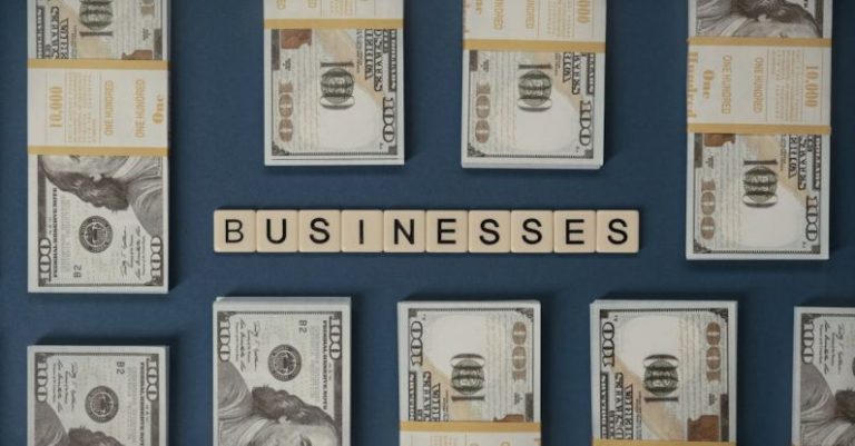 Businesses - 100 Dollar Bills Beside Letter Tiles